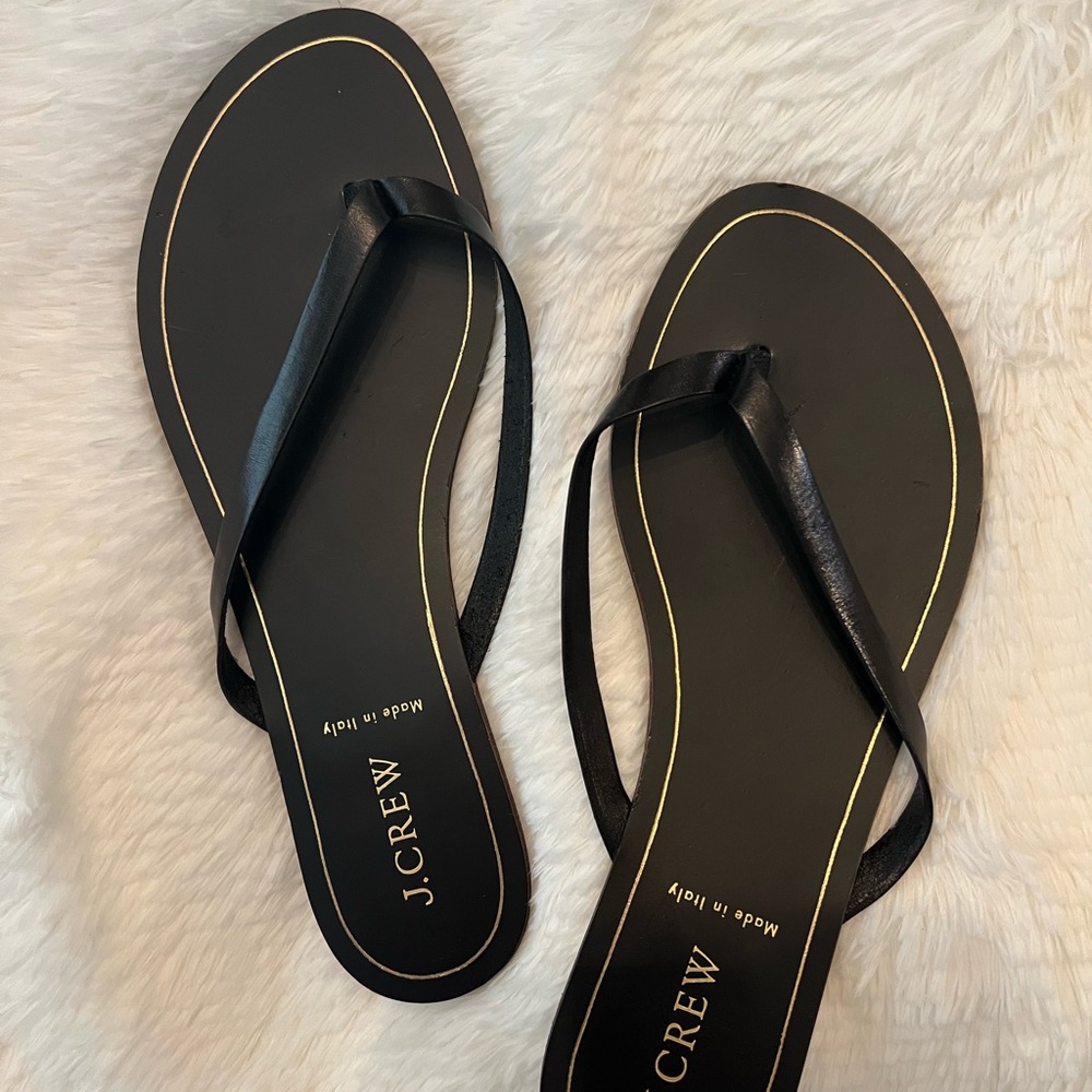 Black leather flip-flop sandals